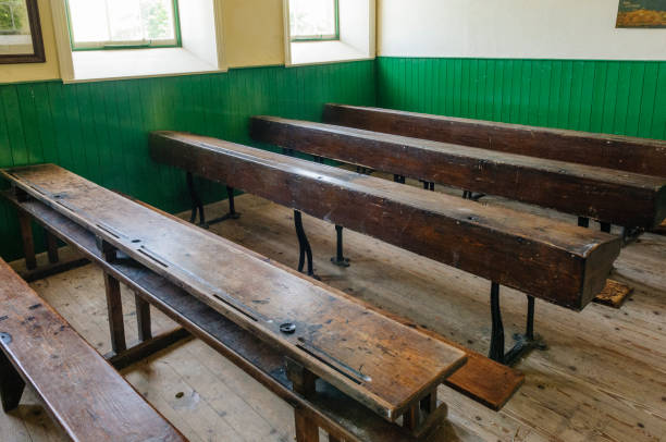 istock Benches in an old fashioned schoolroom 1221637178