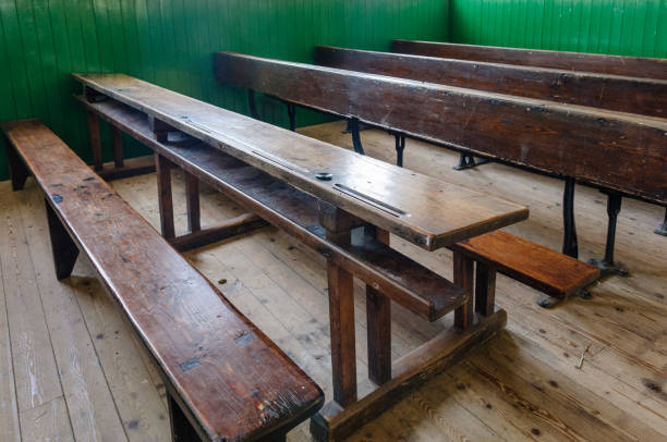 istock Benches in an old fashioned schoolroom 1221637194