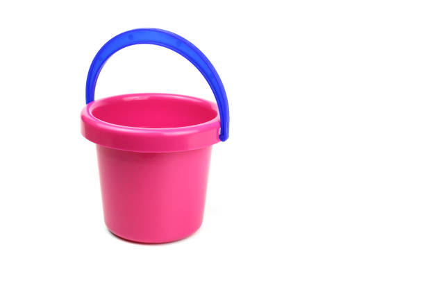 istock Toy bucket pink with blue handle isolated on white 1221638436