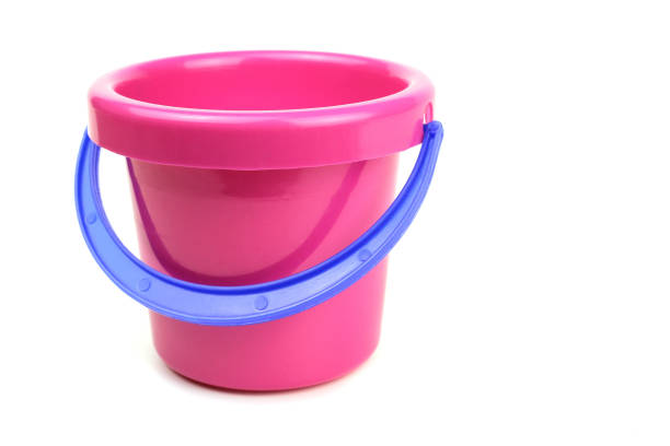 istock Toy bucket pink with blue handle isolated on white 1221638476