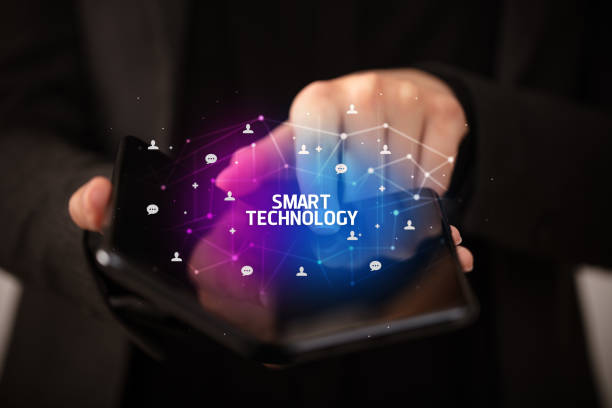 istock Businessman holding a foldable smartphone, new technology concept 1221638550