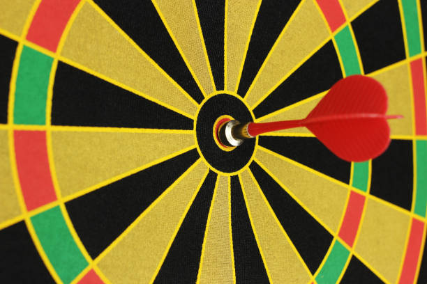istock Red sticks to bullseye on a dart board 1221638601