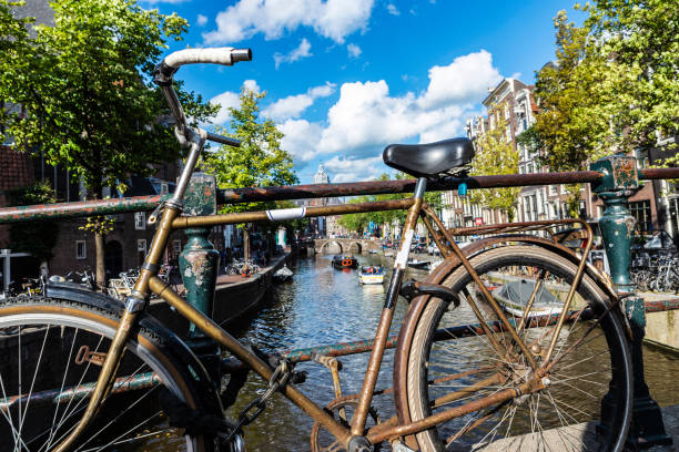istock Old rusty vintage bicycle in Amsterdam, Netherlands 1221638604