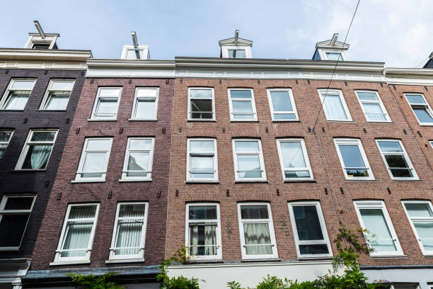 istock Old classic houses in Amsterdam, Netherlands 1221639004