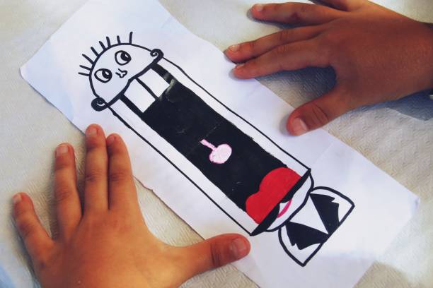 istock Drawing made by a child and his hands. 1221639320