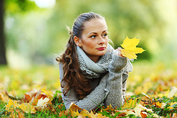 istock woman portret in autumn leaf 122163934