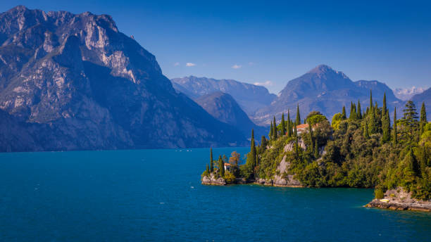 Lake Garda and Trentino Alpine landscape near Malcesine, Italy Lake Garda and Trentino Alpine landscape near Malcesine, Italy italian lake district photos stock pictures, royalty-free photos & images