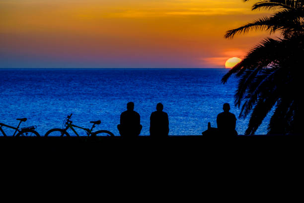 Beautiful silhouette coastal sunset scene at montevideo city, uruguay