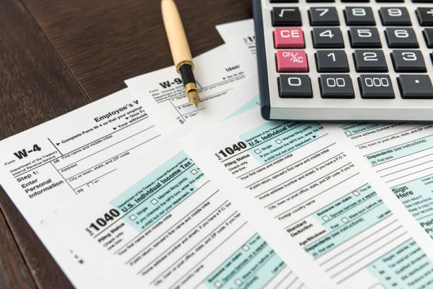 istock 1040 tax form with pen, finance document 1221642452