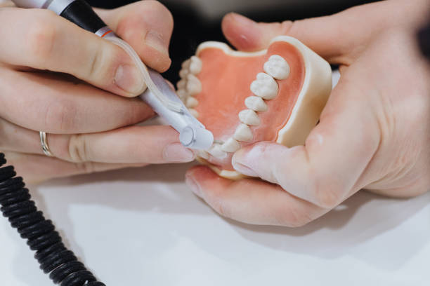 istock A dental technician processes a cast of the jaw 1221642852