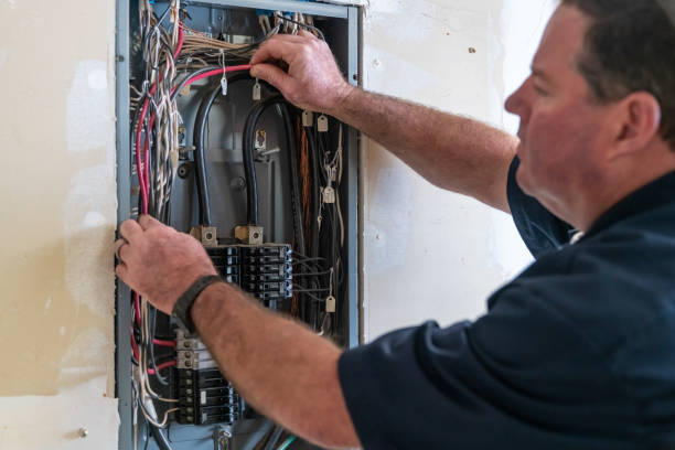 istock Electrician working on circuit breaker box 1221643794
