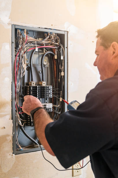 istock Electrician working on circuit breaker box 1221643822
