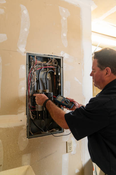istock Electrician working on circuit breaker box 1221643850