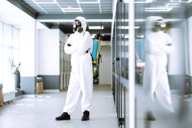 istock Man in protective hazmat suit in an empty office. 1221643869