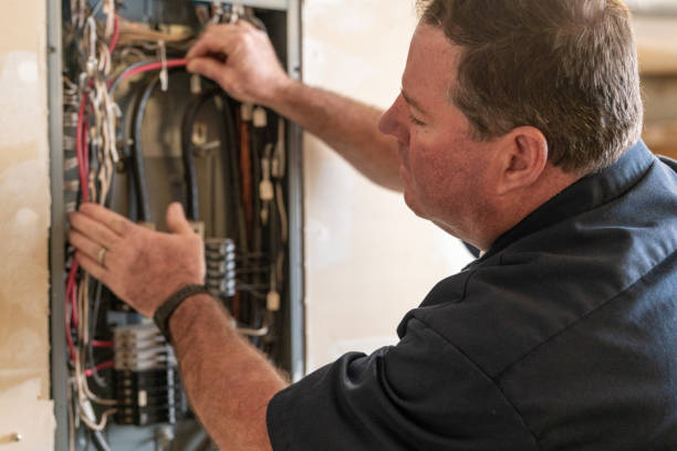 istock Electrician working on circuit breaker box 1221643897