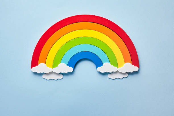 istock Vintage flat card with rainbow with white clouds on blue background. Chase the rainbow 1221644793