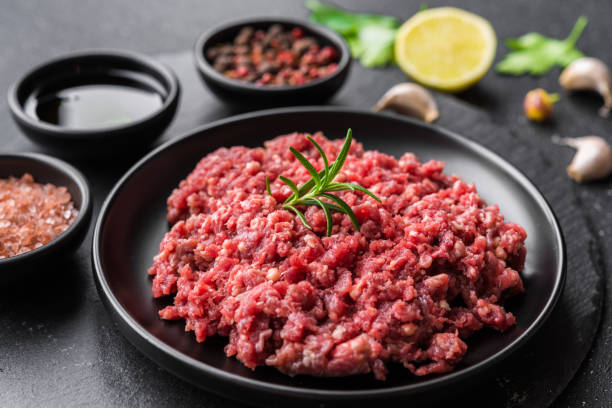 istock Fresh minced meat ground beef on a black plate against stone background 1221645959