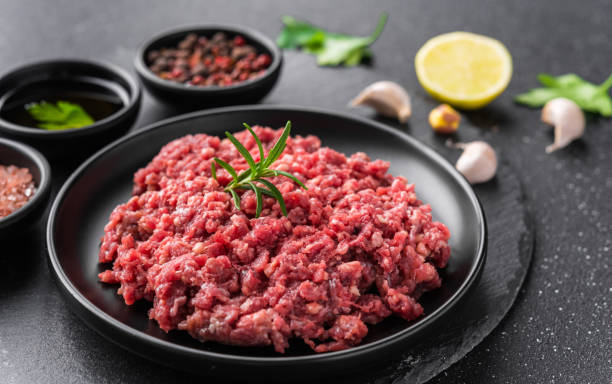 istock Fresh minced meat ground beef on a black plate against stone background 1221645960