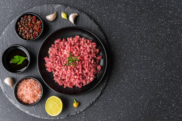 istock Fresh minced meat ground beef on a black plate against stone background 1221645964