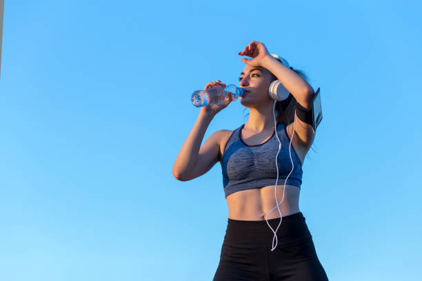 istock Woman hydrating after training 1221646427