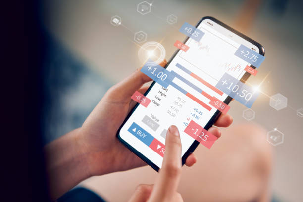 istock Stock exchange market concept, hand trader looking smartphone with graphs analysis candle line, diagrams on screen. 1221646467