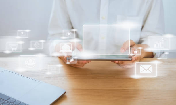 istock Concept technology internet and networking, businessman hand holding tablet with media icon on digital display. Screen for in advertising 1221646745