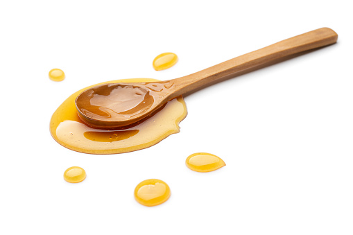 Honey with wooden spoon