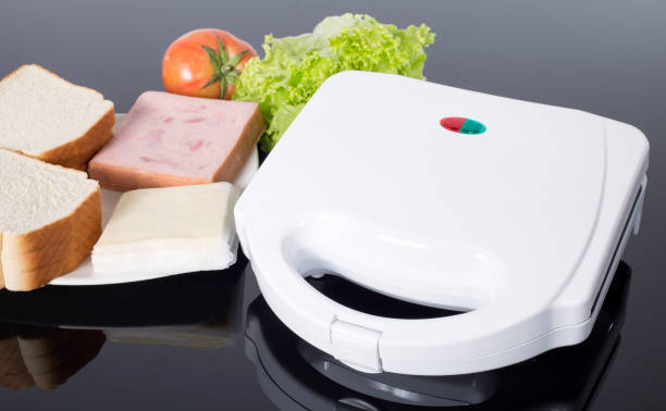 istock sandwich toaster with ingredients on white background 1221648056
