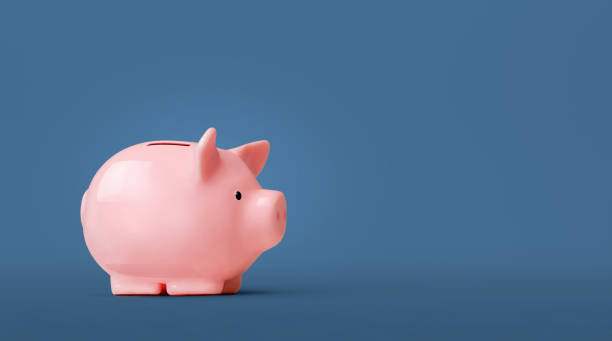 istock Piggy bank isolated on blue background 1221650072