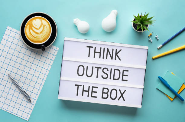 istock Business creativity with think outside the box concepts on cinema light box and worktable.inspiration and motivation.brainstorming and sharing ideas 1221650933