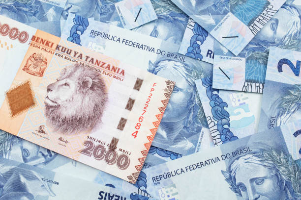 istock An orange Tanzanian shilling note with Brazilian two reais bank notes 1221651364