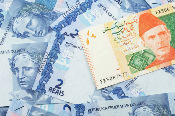 istock A Pakistani rupee bank note with Brazilian two reais bank notes 1221651647