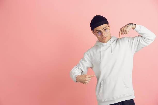 istock Caucasian young man's modern portrait on pink studio background 1221652769