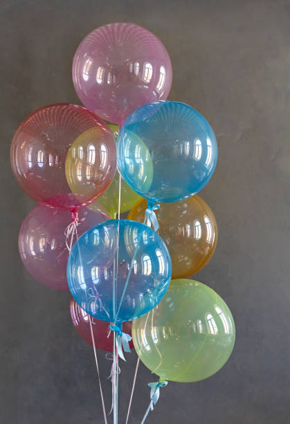 istock Colorful balloons on the grey background 1221653821