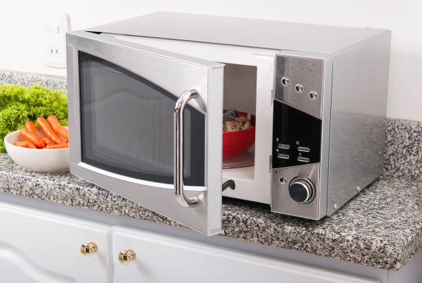 istock Microwave oven; photo in kitchen environment. 1221655459