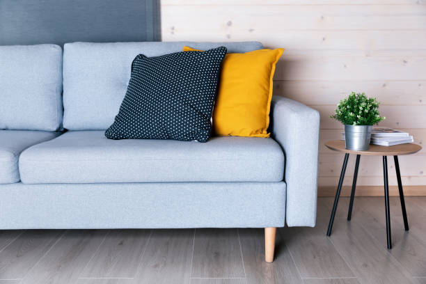 istock Beautiful living room interior with sofa and colorful pillows 1221655881