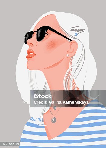 istock Pretty young woman with blonde hair and sunglasses. Female portrait. 1221656191