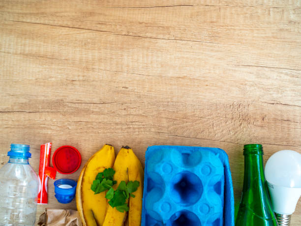 istock Different garbage on wooden background, top view. Reuse, reduce, recycle concept 1221663818