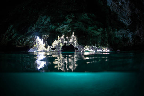 istock Kayak and Dark Cave in Indonesia 1221666117
