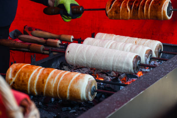 istock Kurtos kalacs or chimney cakes, preparing cooking 1221666908