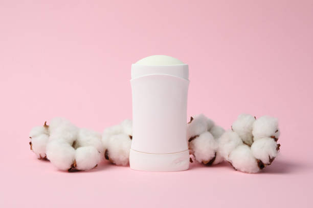 istock Body deodorant and cotton on pink background, blank space for text 1221668235