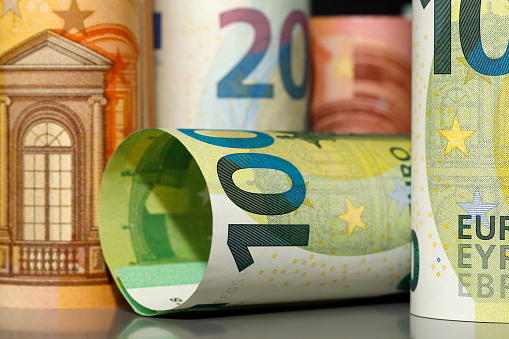There are rolled-up Euro banknotes. This is the concept and idea of the Eurozone.