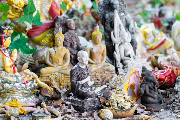 istock Bunch of various old buddhist statues background 1221668898
