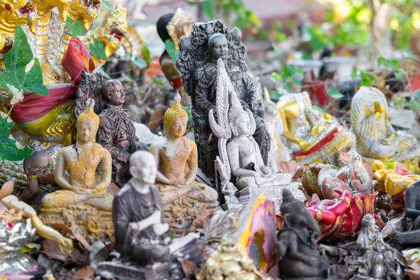 istock Bunch of various old buddhist statues background 1221668913