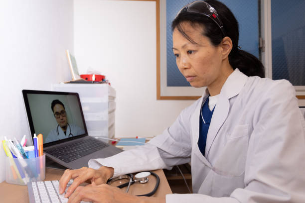 istock Female health care workers having video conference 1221669924