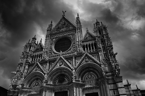 Facade of Duomo di Siena or Siena Cathedral, a medieval church located a few minutes away from Piazza del Campo in Siena, Tuscany region of Central Italy.