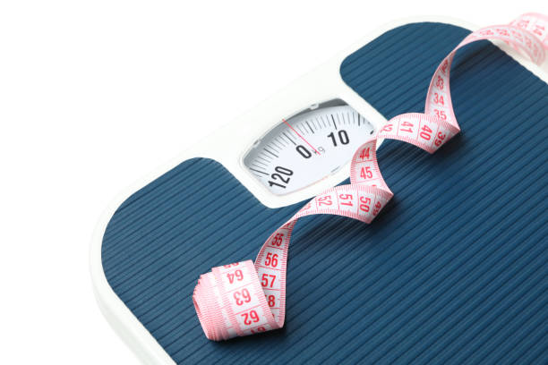 istock Scales and measuring tape isolated on white background 1221672652