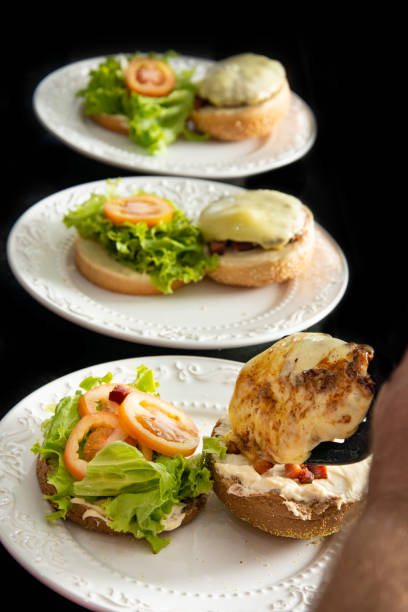 A quality gourmet hamburger with side salad dish at a restaurant in Osaka.