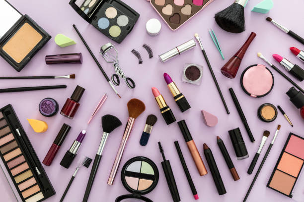 istock Make up cosmetics products against pastel purple background, 1221677105