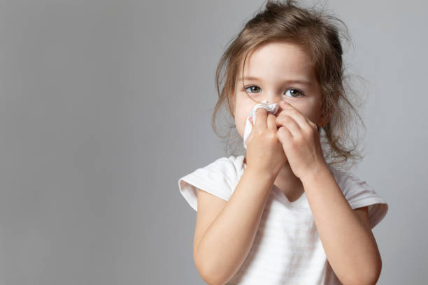 istock Little Girl Cleaning Her Nose 1221677237